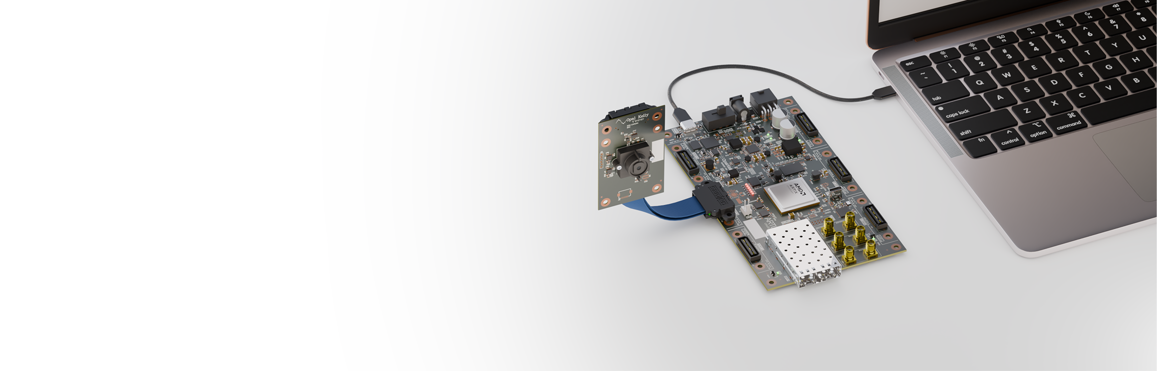 An Opal Kelly XEM8320 module and camera board connected by USB to a laptop