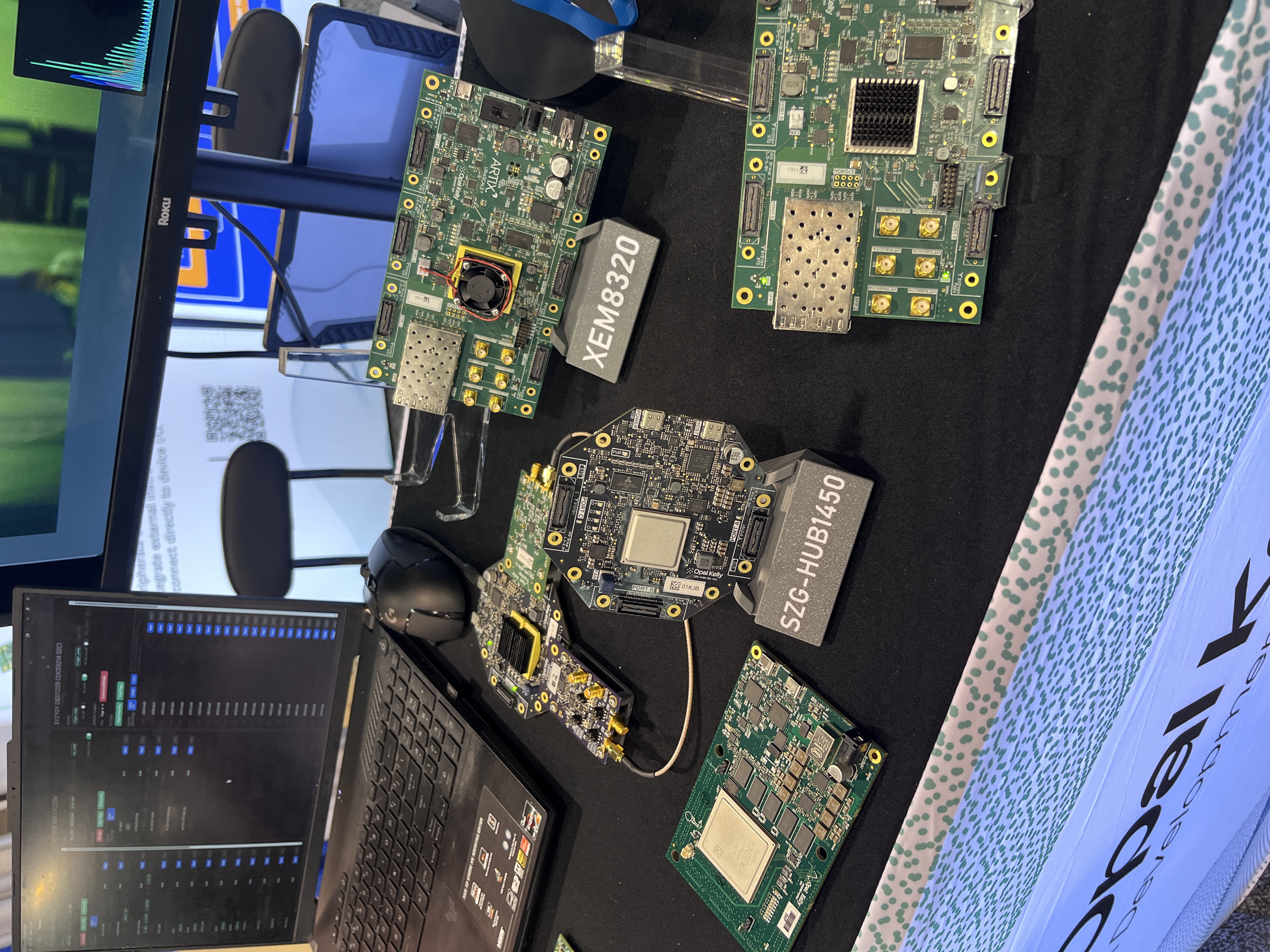 The SYZYGY Hub, XEM8320, and other Opal Kelly boards on the display counter at Embedded World North America 2026
